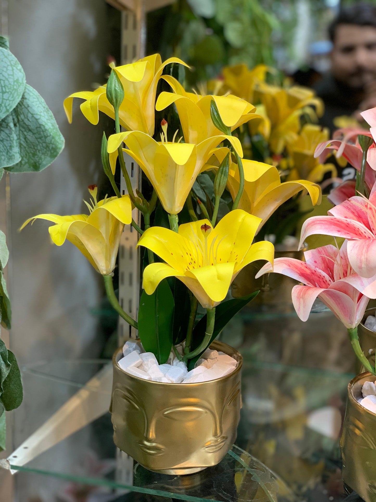 Buddha Face Planters with Artificial Lily Arrangements