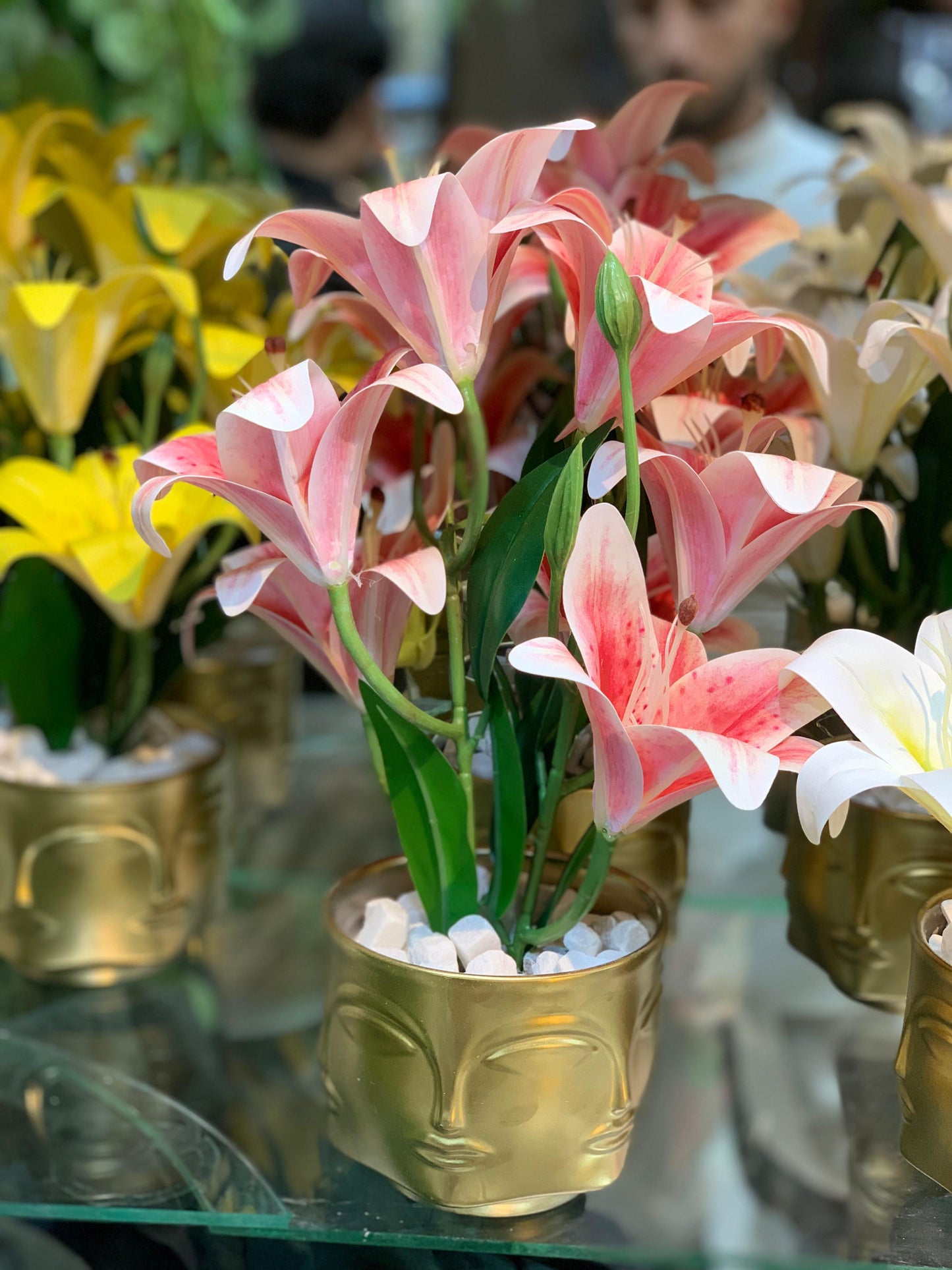 Buddha Face Planters with Artificial Lily Arrangements